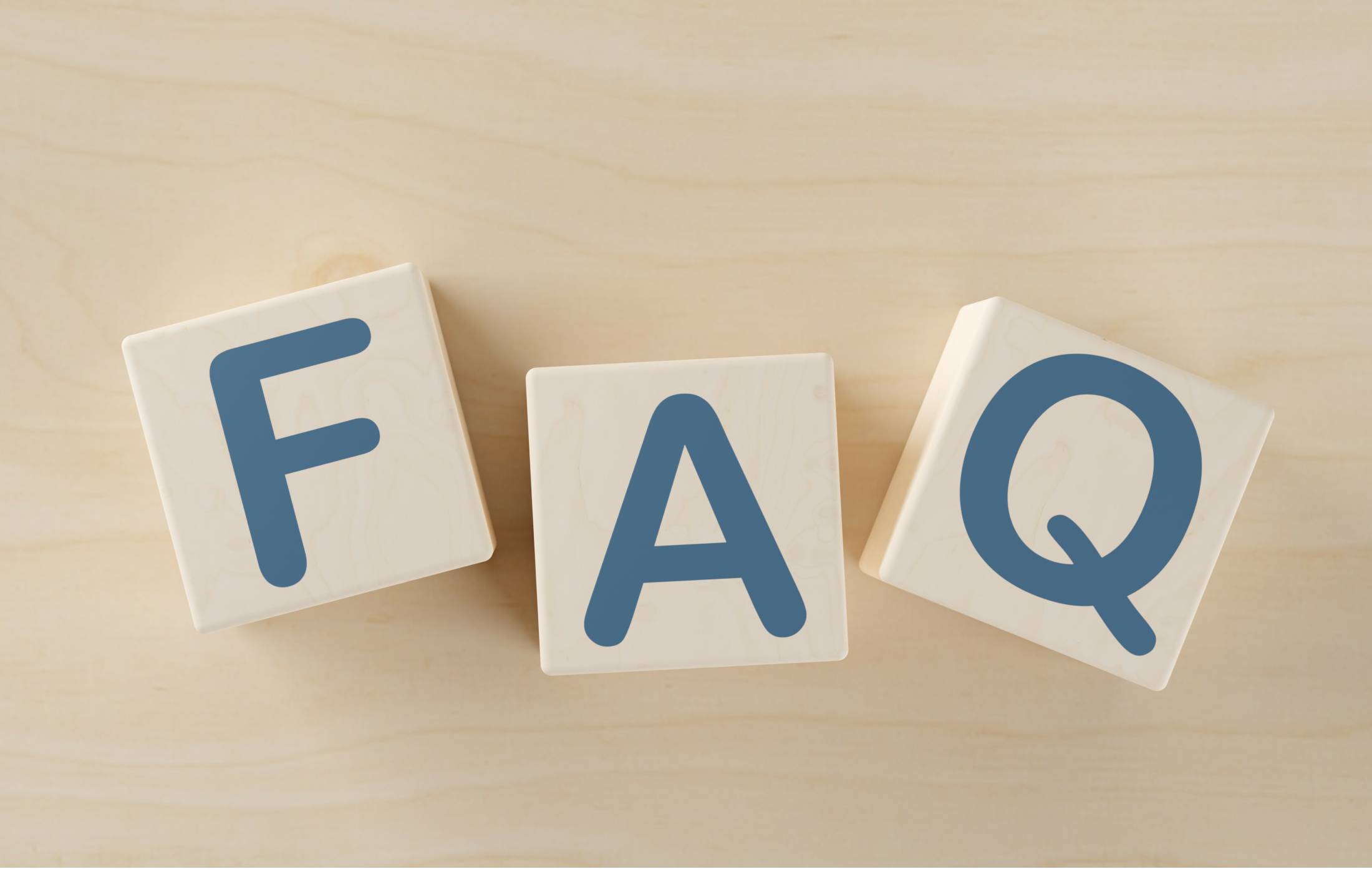 Three wooden blocks that spell out FAQ Near South Surrey, B.C.